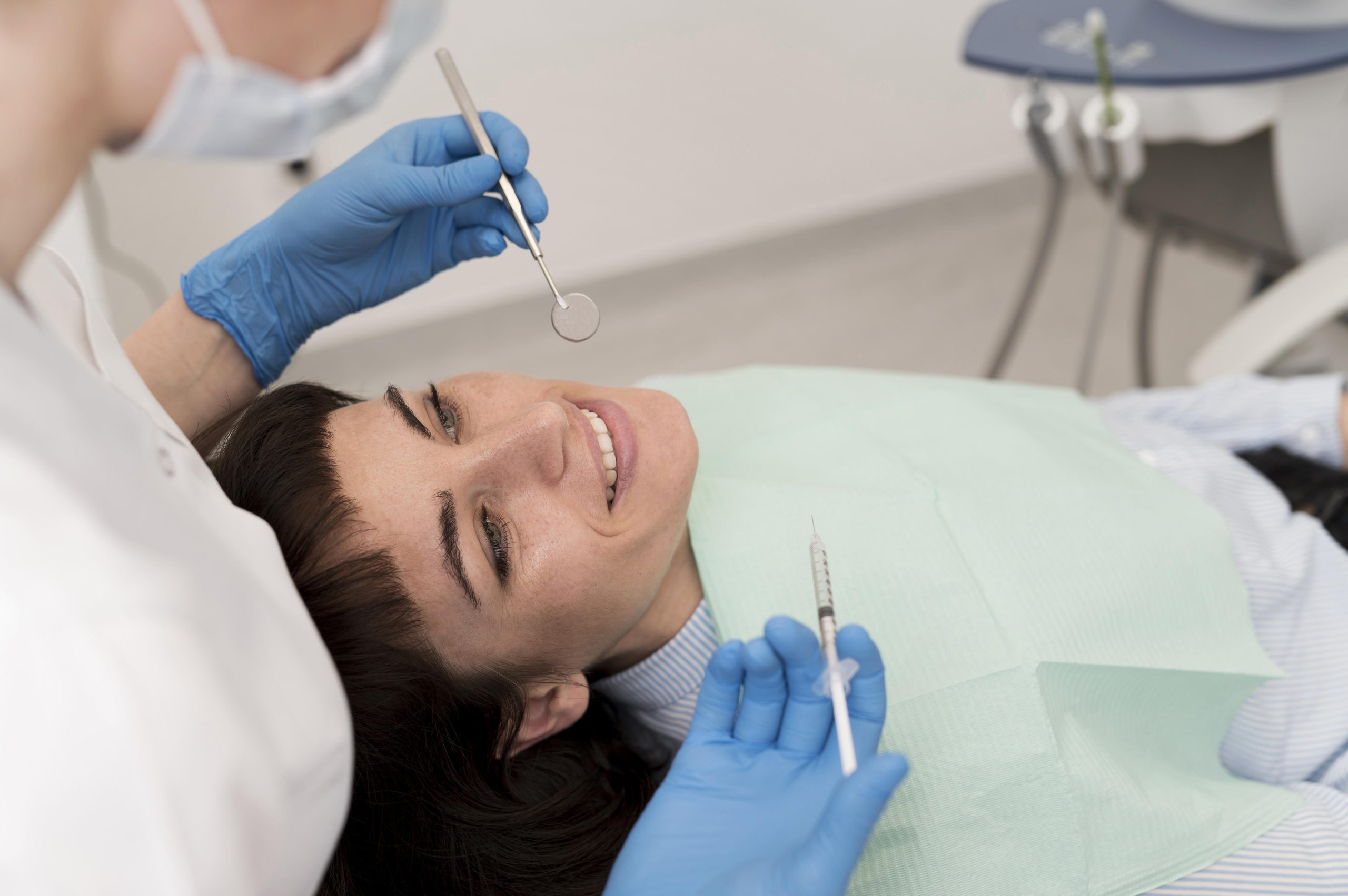 female-patient-having-procedure-done-dentist (1) Dental Filling